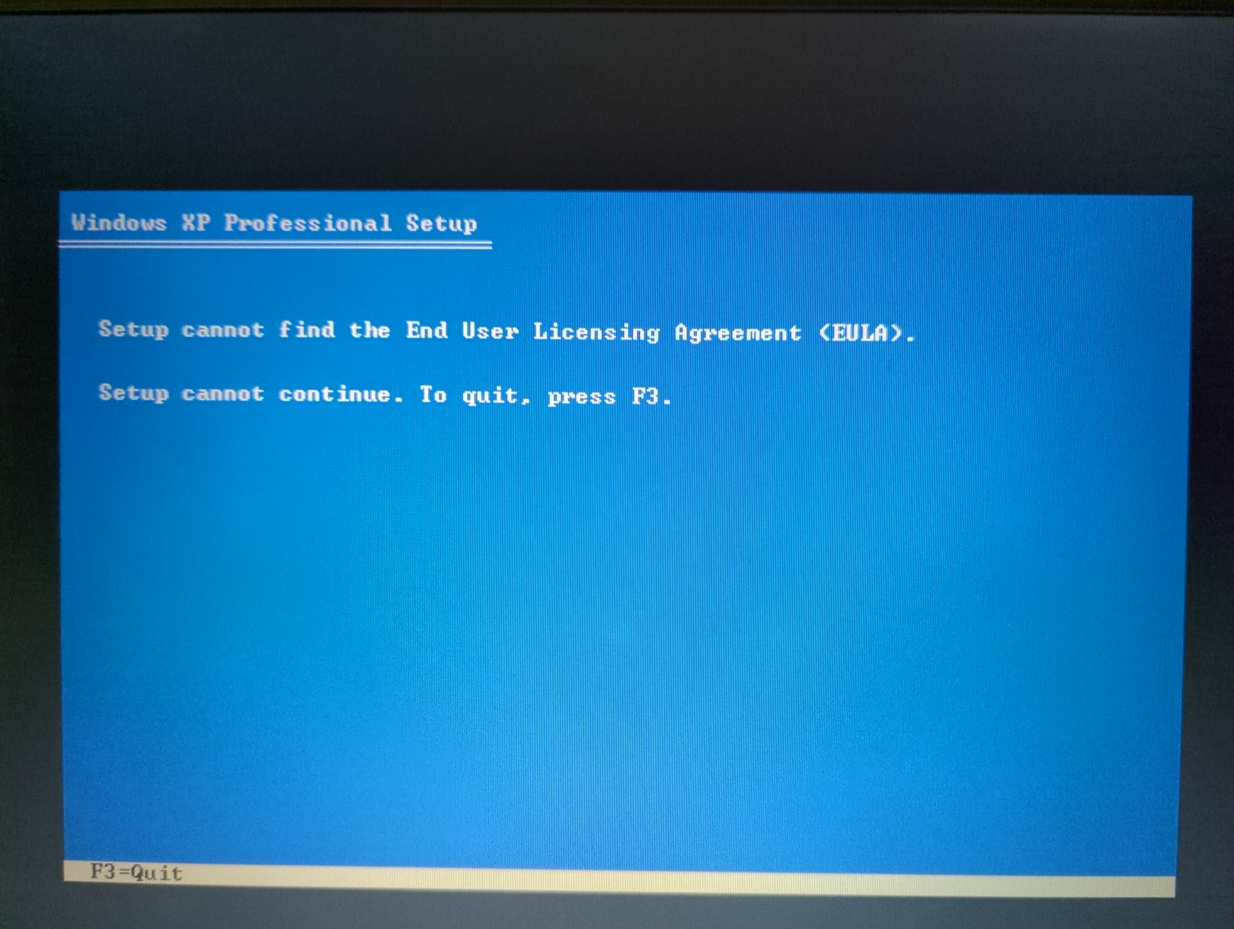 Photo of the Windows XP installer. The error message reads “Setup cannot find the End User Licensing Agreement (EULA).”